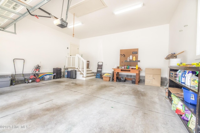 garage featuring a workshop area and a garage door opener