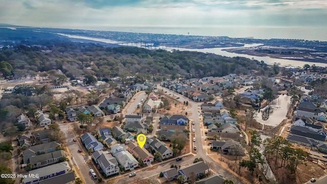 birds eye view of property featuring a water view and a residential view