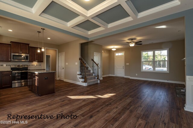 15661 Vista Point Ct, Wagram, NC 28396 - kitchen with stainless steel appliances, open floor plan, coffered ceiling, dark brown cabinets, and a center island