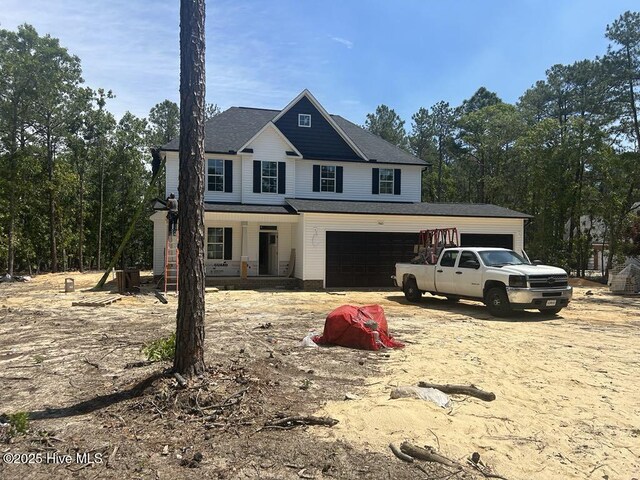 15661 Vista Point Ct, Wagram, NC 28396 - view of front of property with a porch and a garage