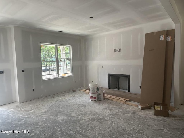 unfurnished living room with a glass covered fireplace