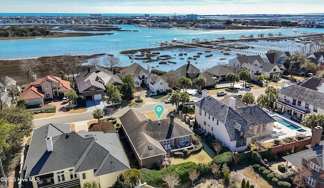 birds eye view of property with a residential view and a water view