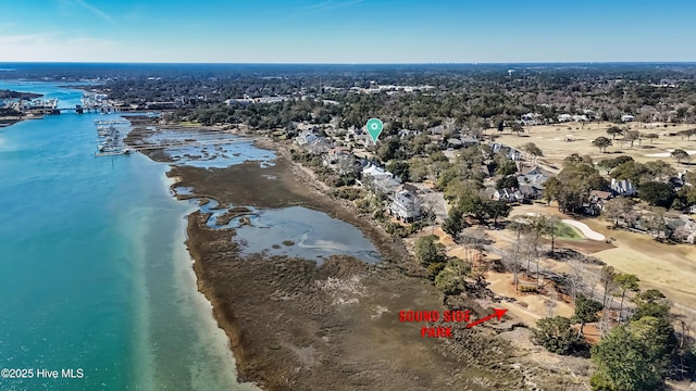 bird's eye view with a water view and a beach view