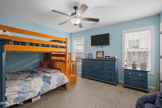 bedroom featuring light colored carpet and ceiling fan