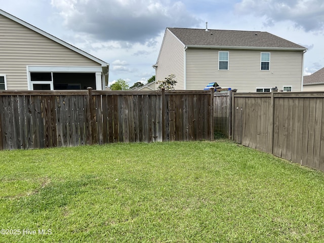 view of yard with a fenced backyard