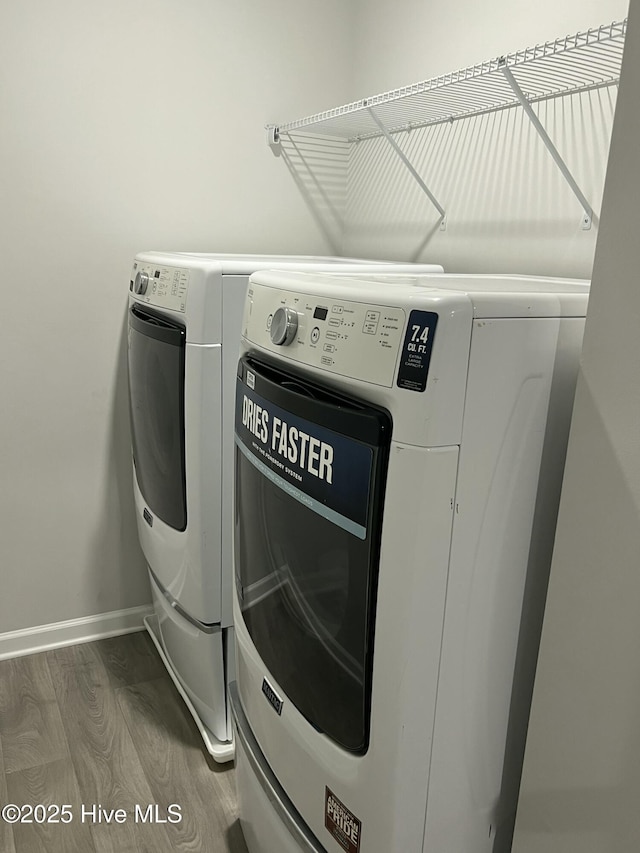 411 Frida Rd, New Bern, NC 28560 - washroom featuring washer and clothes dryer, wood finished floors, and baseboards