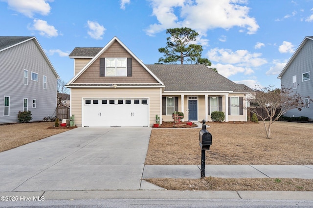 front facade featuring a garage, a front yard, and covered porch