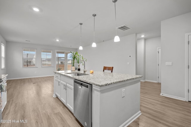 kitchen with sink, a kitchen island with sink, white cabinets, decorative light fixtures, and stainless steel dishwasher