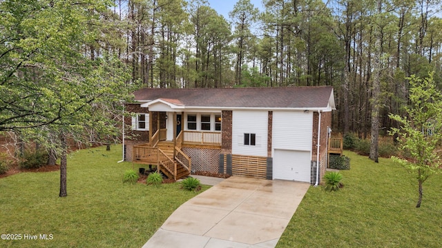 view of front of house featuring driveway, an attached garage, stairs, a porch, and a front yard