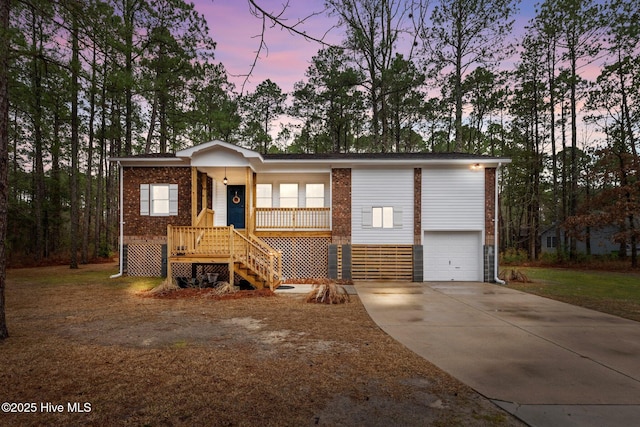 806 Wind Way, New Bern, NC 28560 - ranch-style home with stairs, brick siding, a front yard, concrete driveway, and covered porch