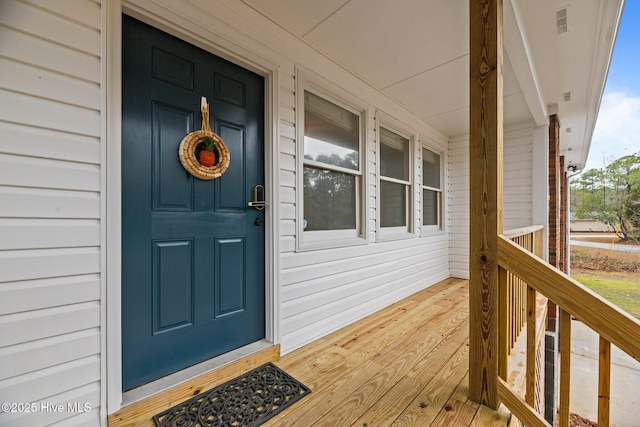 806 Wind Way, New Bern, NC 28560 - doorway to property featuring a porch and visible vents