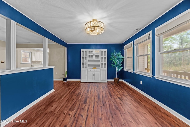 806 Wind Way, New Bern, NC 28560 - entrance foyer featuring baseboards, an inviting chandelier, wood finished floors, and visible vents