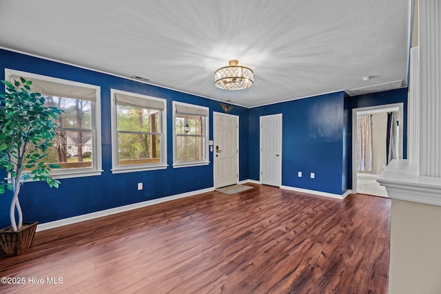 806 Wind Way, New Bern, NC 28560 - interior space with an inviting chandelier, baseboards, wood finished floors, and visible vents