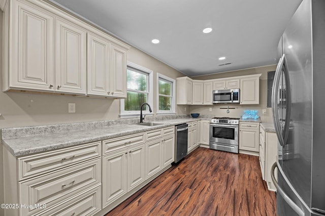 806 Wind Way, New Bern, NC 28560 - kitchen with visible vents, dark wood finished floors, a sink, light countertops, and stainless steel appliances