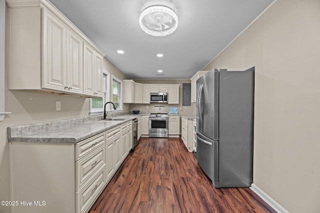 806 Wind Way, New Bern, NC 28560 - kitchen featuring dark wood-style flooring, appliances with stainless steel finishes, a sink, light countertops, and white cabinets