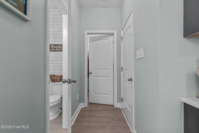 corridor featuring light hardwood / wood-style floors