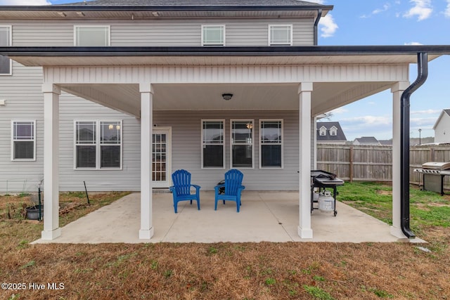 back of house featuring a yard and a patio area