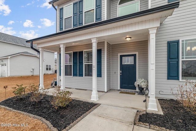 doorway to property featuring covered porch