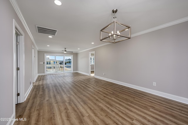 unfurnished living room with ornamental molding, wood-type flooring, and ceiling fan with notable chandelier