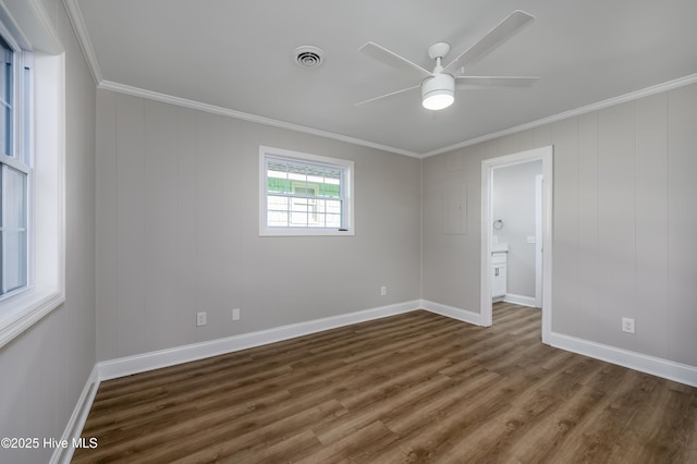 spare room with ornamental molding, dark hardwood / wood-style floors, and ceiling fan