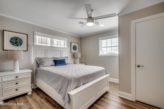 301 43rd Ave N, North Myrtle Beach, SC 29582 - bedroom featuring baseboards, ornamental molding, a ceiling fan, and wood finished floors