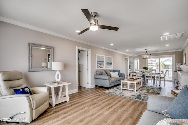 301 43rd Ave N, North Myrtle Beach, SC 29582 - living area featuring recessed lighting, light wood-type flooring, visible vents, a ceiling fan, and crown molding