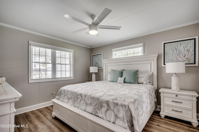 301 43rd Ave N, North Myrtle Beach, SC 29582 - bedroom with crown molding, dark wood-style floors, baseboards, a decorative wall, and a ceiling fan
