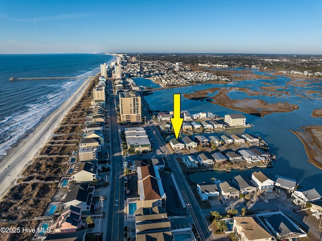 aerial view featuring a view of the beach and a water view