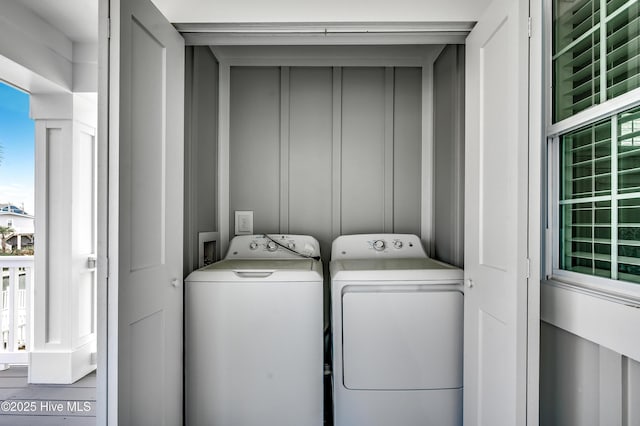 301 43rd Ave N, North Myrtle Beach, SC 29582 - laundry area with washer and clothes dryer, a wealth of natural light, and laundry area