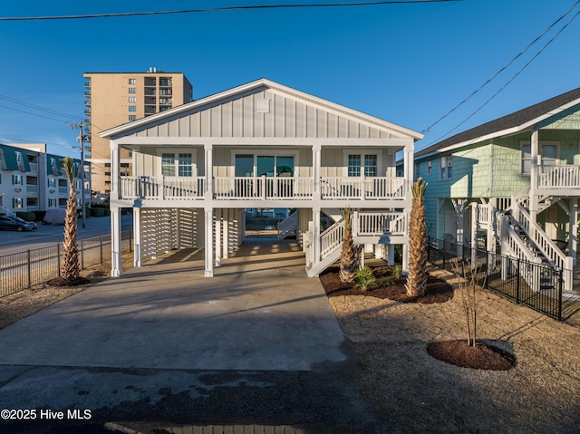 view of front of house with a carport and covered porch