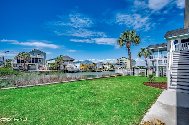 301 43rd Ave N, North Myrtle Beach, SC 29582 - view of yard with a residential view, a water view, and fence
