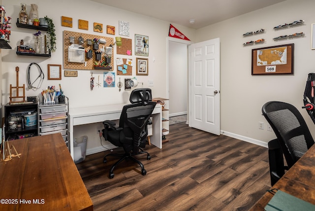 home office featuring dark wood-style flooring and baseboards