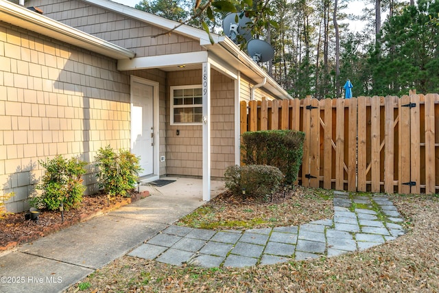 doorway to property with fence