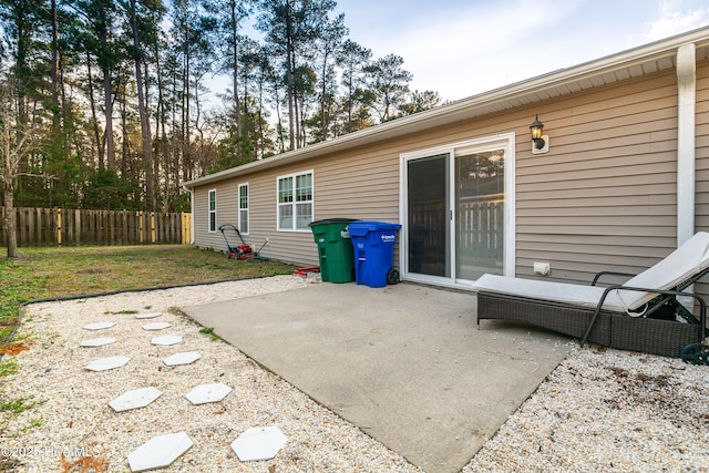 back of house with a yard, a patio area, and fence