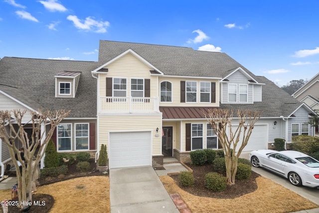 view of front of house with a garage and a balcony