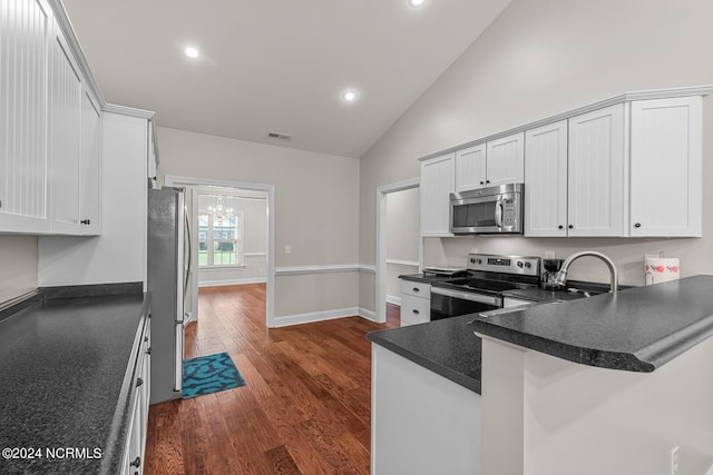 427 Candlewood Dr, Jacksonville, NC 28540 - kitchen with high vaulted ceiling, white cabinets, kitchen peninsula, stainless steel appliances, and dark wood-type flooring