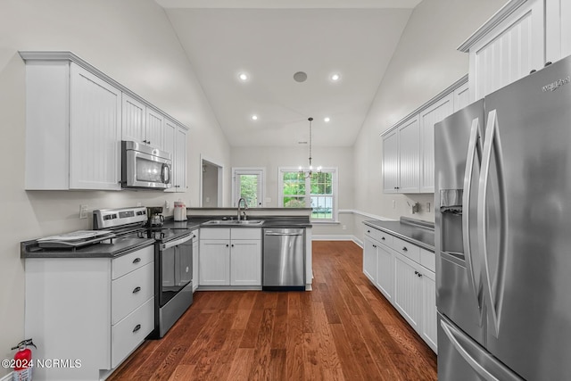 427 Candlewood Dr, Jacksonville, NC 28540 - kitchen featuring sink, appliances with stainless steel finishes, white cabinets, decorative light fixtures, and kitchen peninsula