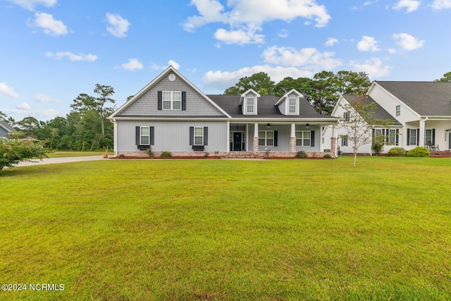 view of front of house featuring a porch and a front yard