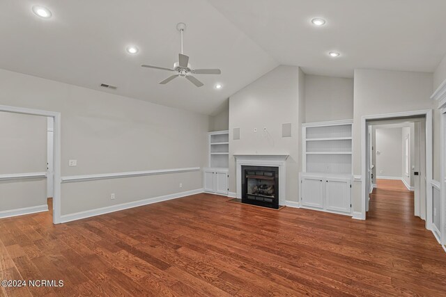 427 Candlewood Dr, Jacksonville, NC 28540 - unfurnished living room with hardwood / wood-style flooring, ceiling fan, vaulted ceiling, and built in features
