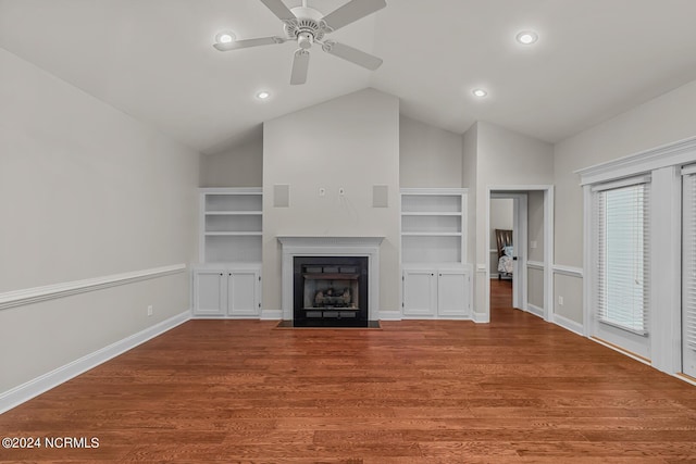 427 Candlewood Dr, Jacksonville, NC 28540 - unfurnished living room featuring vaulted ceiling, hardwood / wood-style floors, ceiling fan, and built in shelves