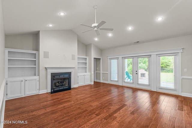 427 Candlewood Dr, Jacksonville, NC 28540 - unfurnished living room featuring high vaulted ceiling, french doors, wood-type flooring, ceiling fan, and built in shelves