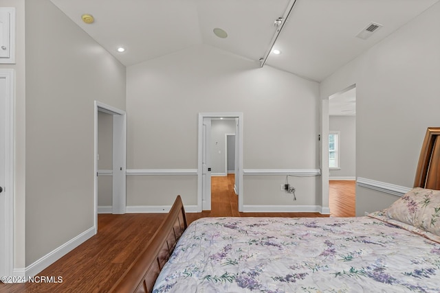 427 Candlewood Dr, Jacksonville, NC 28540 - bedroom featuring lofted ceiling and hardwood / wood-style floors