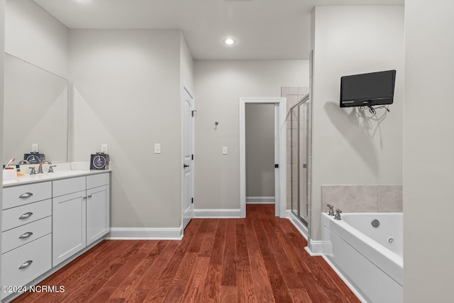 427 Candlewood Dr, Jacksonville, NC 28540 - bathroom featuring hardwood / wood-style flooring, vanity, and shower with separate bathtub
