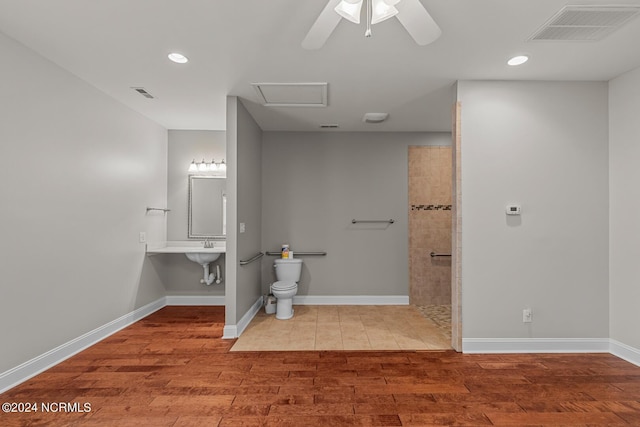 427 Candlewood Dr, Jacksonville, NC 28540 - bathroom featuring hardwood / wood-style floors, ceiling fan, and toilet