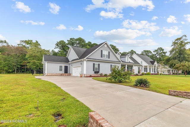 427 Candlewood Dr, Jacksonville, NC 28540 - view of front of home featuring a garage and a front lawn