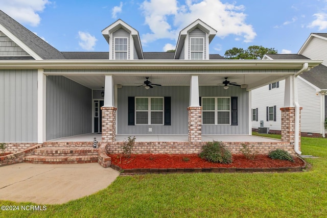 427 Candlewood Dr, Jacksonville, NC 28540 - view of front of property with ceiling fan, covered porch, a front lawn, and central air condition unit