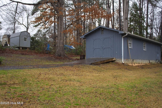 view of outbuilding featuring a yard