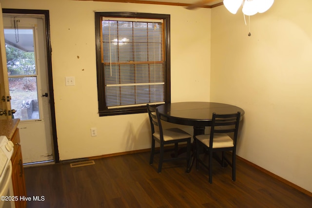 dining space featuring dark hardwood / wood-style flooring