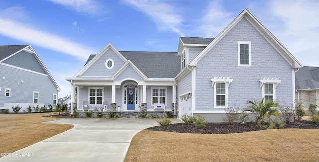 view of front facade featuring a porch and a shingled roof