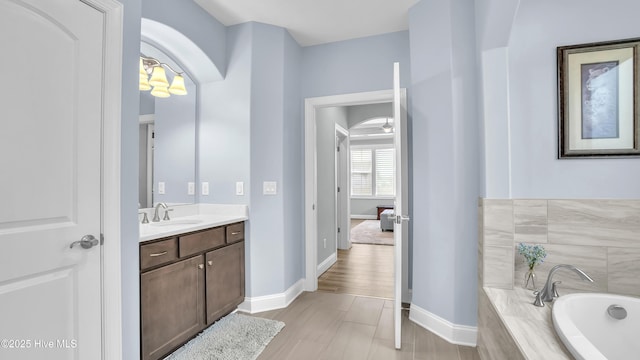 4358 Cobleskill Dr, Leland, NC 28451 - full bath with vanity, a garden tub, and baseboards